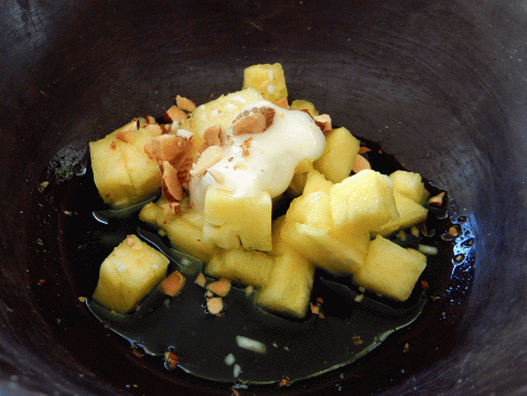 Criollo dessert of pineapple with almond brittle