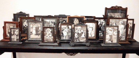 "Grandmother's Library Table with Photographs," collected swing frames with ink paintings, 2001
